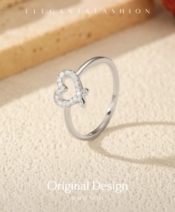 Detail of S925 sterling silver ring with asymmetrical heart and sparkling moissanite stones