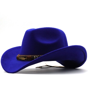 Detail view of a navy blue felt fedora featuring a braided band and gold metal feather charm
