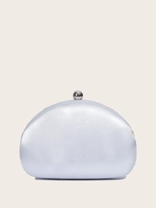Close-up of elegant silver satin shell evening clutch bag with a spherical metal clasp