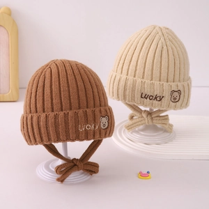 Knitted winter hat for babies with Lucky bear embroidery and earflaps in brown and beige