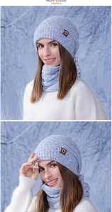 Close-up of knit winter hat and scarf set with blue and pink flecked wool textures