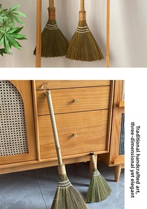 Detail of traditional handmade miscanthus broom set with bamboo handles and hanging loops