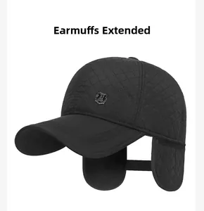Close-up of winter quilted baseball cap with unfolded earflaps and metal shield emblem