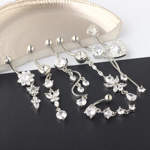 7-piece silver belly piercing set with white zircon flower, heart and butterfly tassels