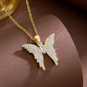 Elegant gold butterfly necklace with zircon butterfly pendant on a stylish display stand