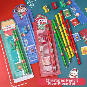 Close-up of a 5-piece Christmas stationery set for kids with Santa and reindeer designs