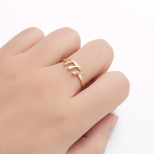 Macro shot of matte gold angel number ring with geometric engraving for men and women