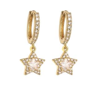 Detail of gold star drop earrings with micro-paved cubic zirconia stones and pavé hoops
