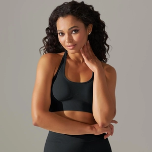 Detailed texture of seamless black ribbed knit sports top and high-waist leggings