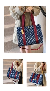 Blue and white checkered denim tote bag with frayed edges and red fabric shoulder straps