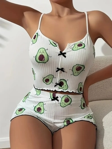 Detail of ribbed pajama set with avocado print and delicate black bow accents
