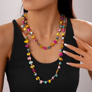 Detail of multi-colored irregular beaded necklace with a bohemian vacation style