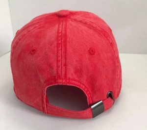 Detail of vintage red washed cotton baseball cap showing adjustable metal buckle at the back