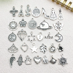 Assorted antique silver alloy charms including Eiffel Tower and heart shapes for DIY jewelry