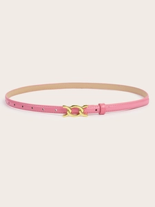Detailed shot of a slim pink leather belt featuring an elegant gold overlapping buckle