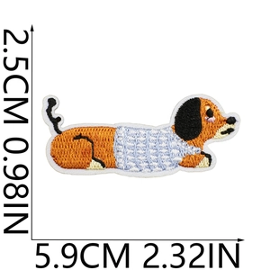 Detailed macro view showing a 2.5cm by 5.9cm dachshund embroidery patch with size markers