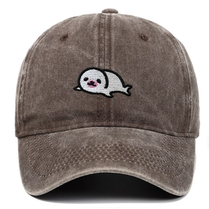 Close-up of fine seal embroidery on dark brown washed cotton baseball cap texture