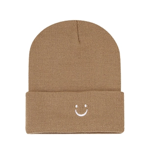 Classic camel ribbed knit beanie with white embroidered smiley face on wide cuff