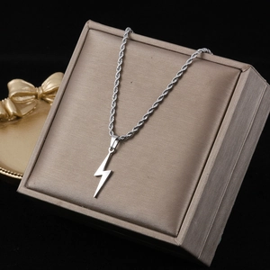 Silver lightning bolt pendant with rope chain displayed in a beige jewelry box