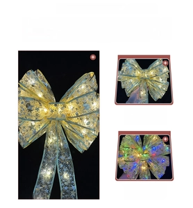 Detail of gold LED Christmas ribbon with sparkling star patterns for DIY gift wrapping
