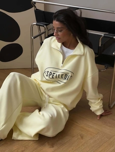 Women's light yellow half-zip tracksuit with long sleeves and printed jogging pants set