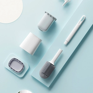 Multifunctional TPR toilet brush set with gray brush head and holder on blue background
