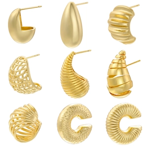 Collection of nine gold earrings with drop, spiral, and woven textures in high polish finish