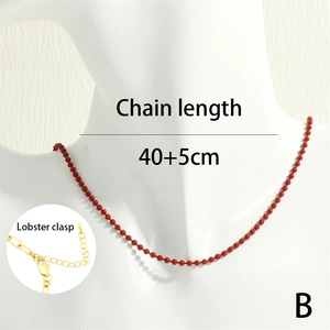 Detail of red bead chain necklace showing 40+5cm length and lobster clasp