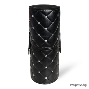 Quilted black cylinder makeup brush holder with silver studs and dustproof lid