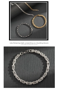 Detailed close-up of heavy Byzantine stainless steel bracelets in gold, silver, and black finishes