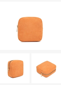 Detailed views of orange corduroy mini makeup bag showing front, side and top angles