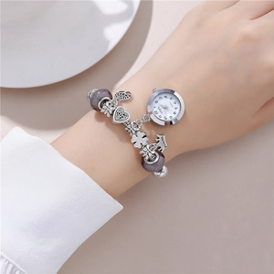 Women's beaded charm bracelet watch with silver crown pendant and purple beads