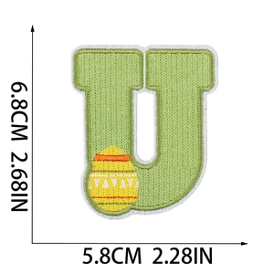 Detailed macro shot of Easter letter U embroidery patch with egg motif and measurements