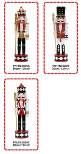 Detailed view of three 30cm wooden nutcracker soldiers in red, black, and white gold finish