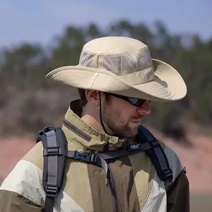 Khaki outdoor sun hat with breathable mesh and adjustable chin strap on male model