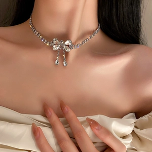 Elegant rhinestone bow necklace with crystal teardrop charms and sparkling choker chain