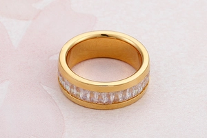 Macro detail of gold plated stainless steel ring with channel-set baguette cubic zirconia