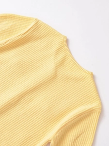 Close-up of bright yellow rib-knit fabric texture and stitching on the crewneck cardigan