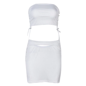 Close-up of white ribbed knit fabric featuring drawstring lace-up side details on the skirt