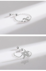 Detail of adjustable S925 silver rings with pavé zircon infinity and star motifs