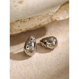 Elegant silver teardrop earrings with colorful rhinestones on a natural stone base