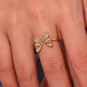 Detailed close-up of a 18K gold-plated butterfly open ring with sparkling cubic zirconia
