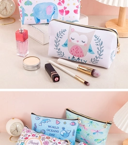 Detail showing various patterned makeup bags with zippers, floral and animal prints