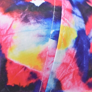 Detail of star-gradient cotton baseball cap showing twill texture and white stitching