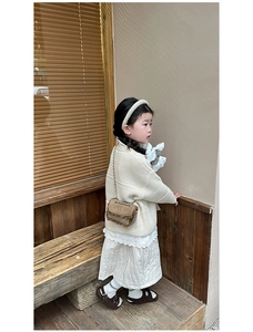 Girl's autumn outfit featuring waffle knit cardigan and brown tassel chain crossbody bag