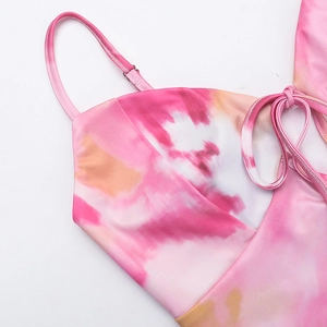 Detail of pink tie-dye dress with delicate straps, buckle and high-quality stitching