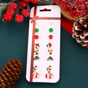 7-pair Christmas stud earring set featuring Santa, deer, and tree designs in festive style