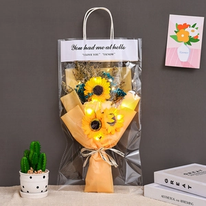 Detail of yellow sunflower soap bouquet with LED lights in orange gift wrap