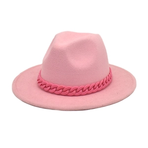 Detailed close-up of a pink wool fedora hat with a thick decorative acrylic link chain