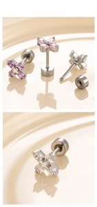 Detail of square zircon cross earrings in titanium steel with secure screw back closure